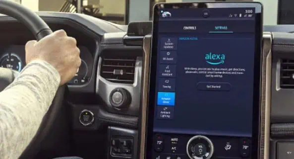 Car dashboard with large touchscreen featuring Amazon Alexa integration settings.